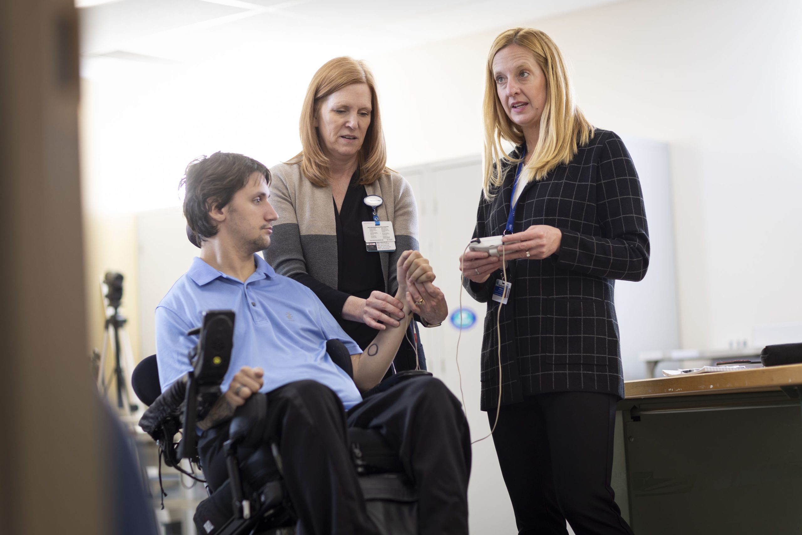 Study participant using the networked neuroprosthesis device