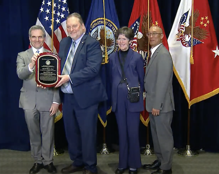 Dr. Robert Kirsch receiving the Paul B. Magnuson award